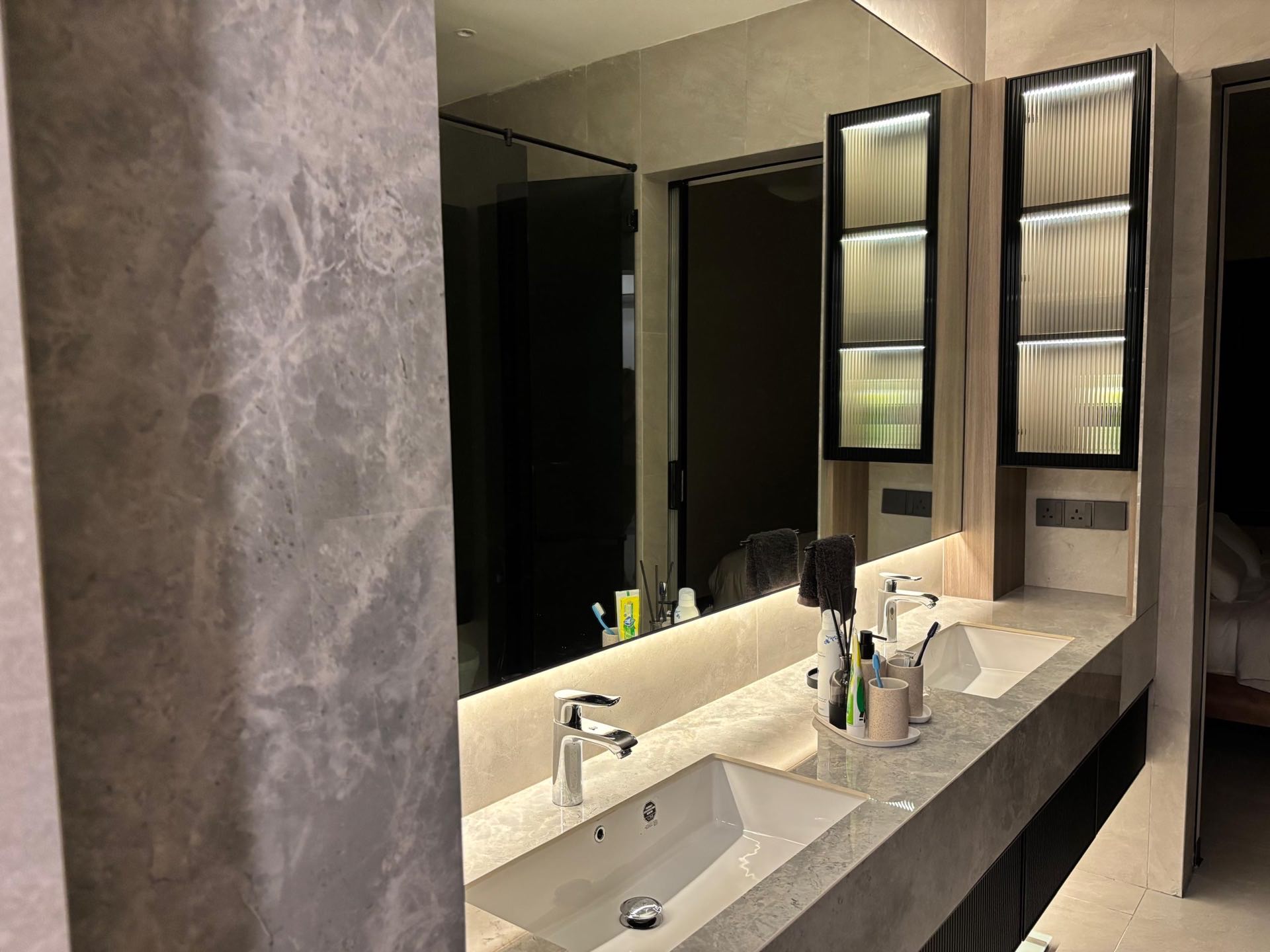 Bathroom detail with tile pattern and brass fixtures